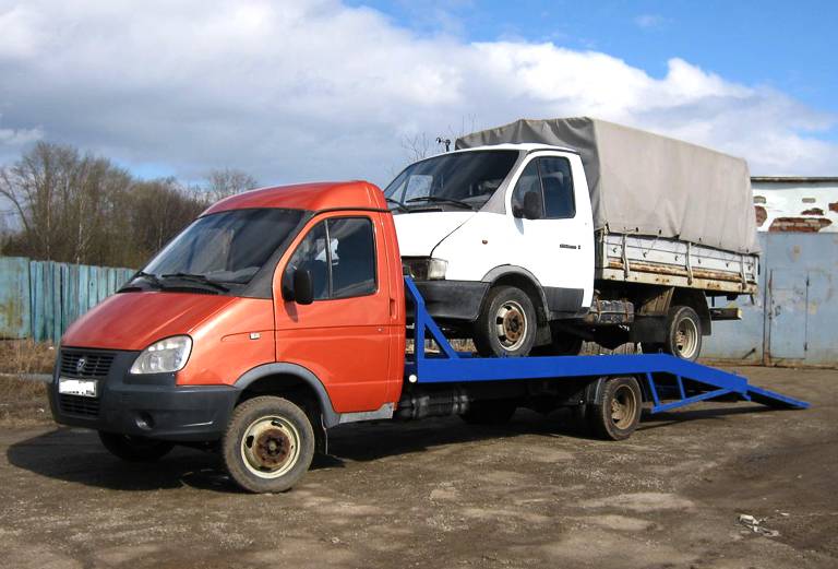 Перевозка авто сеткой, эвакуатор для автомобиля из Рощинского в Сургут